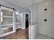 Well-appointed bathroom featuring a walk-in shower, vanity, and decorative sliding door for a spa-like feel at 4330 Oasis Hill Ave, North Las Vegas, NV 89085