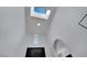 View of the entryway with skylight and transom window at the top and a black door below at 4330 Oasis Hill Ave, North Las Vegas, NV 89085