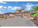 Charming two-story home with a three-car garage and desert landscaping at 4330 Oasis Hill Ave, North Las Vegas, NV 89085