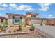 Beautiful two-story home featuring desert landscaping and a three-car garage at 4330 Oasis Hill Ave, North Las Vegas, NV 89085