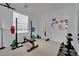 Home gym with weightlifting equipment, whiteboard, neutral paint, and carpet at 4330 Oasis Hill Ave, North Las Vegas, NV 89085