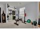 Home gym with carpet, weightlifting equipment, and a closet with storage at 4330 Oasis Hill Ave, North Las Vegas, NV 89085