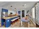 Open kitchen boasts granite counters, stainless steel appliances, an island with seating, and an adjacent dining area at 4330 Oasis Hill Ave, North Las Vegas, NV 89085