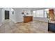 Open-concept living room features tile flooring, white walls and a built-in bar at 4330 Oasis Hill Ave, North Las Vegas, NV 89085