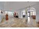 Bright living room boasts tile floors, neutral walls, and modern lighting at 4330 Oasis Hill Ave, North Las Vegas, NV 89085