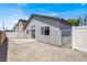Private backyard with stucco wall and white vinyl fencing and desert landscaping at 4375 Pittsfield St, Las Vegas, NV 89115
