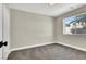 Neutral bedroom with carpeted floor, a window providing natural light, and painted in a light shade at 4375 Pittsfield St, Las Vegas, NV 89115