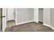 Bedroom with neutral carpet, white trim and doors, and ample closet space with nearby access to bathroom at 4375 Pittsfield St, Las Vegas, NV 89115
