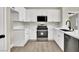 Modern kitchen featuring white cabinets, stainless steel appliances, and a stylish countertop at 4375 Pittsfield St, Las Vegas, NV 89115