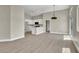 Bright living space featuring modern flooring, recessed lighting, and an open floorplan to the kitchen at 4375 Pittsfield St, Las Vegas, NV 89115