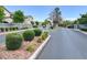 Entrance to a gated community with mature trees and lush landscaping at 4375 Pittsfield St, Las Vegas, NV 89115