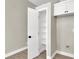 Bright pantry with open white shelving for optimal storage, accompanied by a storage cabinet above at 4375 Pittsfield St, Las Vegas, NV 89115