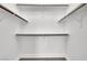 Spacious walk-in closet with multiple shelves and rods for ample storage at 4375 Pittsfield St, Las Vegas, NV 89115