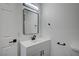 Elegant bathroom features a sleek mirror, modern vanity, and chic fixtures at 4419 Fairmont Cir, Las Vegas, NV 89147