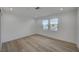 Bright, empty bedroom with recessed lighting and wood-look flooring at 4419 Fairmont Cir, Las Vegas, NV 89147