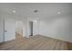 Bright, empty bedroom features wood-look flooring, closet and fresh white paint at 4419 Fairmont Cir, Las Vegas, NV 89147