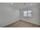 Clean bedroom with wood-look floors, recessed lighting and a large window at 4419 Fairmont Cir, Las Vegas, NV 89147