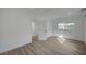 A bedroom features light wood flooring, recessed lighting, and access to a bathroom at 4419 Fairmont Cir, Las Vegas, NV 89147