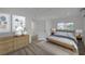 Stylish bedroom with a comfortable bed, a dresser, and neutral decor creating a peaceful retreat at 4419 Fairmont Cir, Las Vegas, NV 89147
