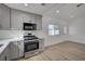 Bright kitchen showcasing stainless steel stove, white countertops, and gray cabinetry at 4419 Fairmont Cir, Las Vegas, NV 89147