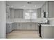 Modern kitchen features gray cabinets, white countertops, and stainless steel appliances at 4419 Fairmont Cir, Las Vegas, NV 89147