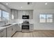 Beautiful kitchen featuring stainless steel appliances and gray cabinetry at 4419 Fairmont Cir, Las Vegas, NV 89147