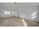 Bright, spacious living area with laminate flooring and recessed lighting at 4419 Fairmont Cir, Las Vegas, NV 89147