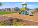 Community playground with colorful play structure set in a well maintained park at 4928 Canna Lily St, Las Vegas, NV 89122
