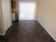 Open dining area with dark tile floors, natural light, and a sliding glass door leading to outdoor space at 500 S 13Th St # C6, Las Vegas, NV 89101