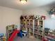 Playroom featuring carpet floors, ample shelving, and a play area at 5404 Scandia Lore Ct, Las Vegas, NV 89130