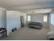 Spacious bonus room with ample natural light and neutral carpet at 5404 Scandia Lore Ct, Las Vegas, NV 89130