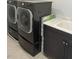 Convenient laundry room with modern washer, dryer, and stylish sink at 5404 Scandia Lore Ct, Las Vegas, NV 89130