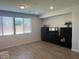 Well-lit living room with hardwood floors and large windows at 5404 Scandia Lore Ct, Las Vegas, NV 89130