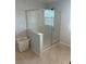 Modern bathroom with a glass-enclosed shower and neutral finishes at 5404 Scandia Lore Ct, Las Vegas, NV 89130