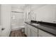 Modern bathroom features a glass shower and a sink with a granite countertop at 6245 Blood Lily Ave, Las Vegas, NV 89122