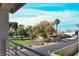 Scenic balcony view showcasing a well-manicured lawn and lush trees under a bright, sunny sky at 63 Harrison Rose Ct, Las Vegas, NV 89110