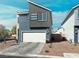 Contemporary two-story home with two-car garage, clean lines, and low maintenance landscaping at 63 Harrison Rose Ct, Las Vegas, NV 89110