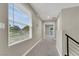 Upstairs hallway with modern railing and view of outdoors at 63 Harrison Rose Ct, Las Vegas, NV 89110