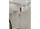 Clean hallway showcasing wall shelves, offering a view into other areas of the home at 63 Harrison Rose Ct, Las Vegas, NV 89110
