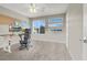 Bright home office featuring a large window, a modern desk, and a comfortable ergonomic chair at 63 Harrison Rose Ct, Las Vegas, NV 89110