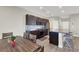 Open-concept kitchen and dining area with stainless appliances and modern finishes at 63 Harrison Rose Ct, Las Vegas, NV 89110
