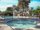 Inviting community pool area with a spa and fencing, perfect for relaxation at 63 Harrison Rose Ct, Las Vegas, NV 89110