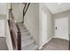 Carpeted staircase with modern railing and white interior doors at 63 Harrison Rose Ct, Las Vegas, NV 89110