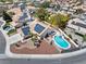 Enjoy this spectacular aerial view showcasing the solar panels and backyard pool in a desert landscape at 6328 Yankee Meadow Cir, Las Vegas, NV 89130