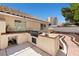 The backyard features an outdoor kitchen area with a built-in grill, storage, and workspace at 6328 Yankee Meadow Cir, Las Vegas, NV 89130