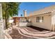 Private backyard featuring a built-in outdoor kitchen and brick-lined walkways at 6328 Yankee Meadow Cir, Las Vegas, NV 89130