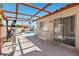 The backyard patio offers a shaded seating area with a view of the pool and well-maintained yard at 6328 Yankee Meadow Cir, Las Vegas, NV 89130