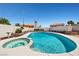 Backyard pool and spa with decorative tile and rock landscaping in a private backyard setting at 6328 Yankee Meadow Cir, Las Vegas, NV 89130