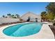 Relaxing backyard pool with lush landscaping and covered patio is the perfect spot for outdoor enjoyment at 6328 Yankee Meadow Cir, Las Vegas, NV 89130