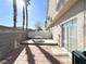 Private backyard featuring a small deck, patio, and access to the home's sliding glass door at 6459 Rusticated Stone Ave # 103, Henderson, NV 89011